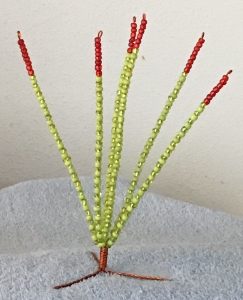 I purchased this little wire and bead sculpture of an Ocotillo at an "illegal" store along a trail overlooking the Rio Grande.